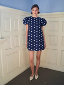 The Golden Hour Mini Dress in Navy Polka Dot