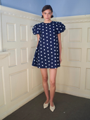 The Golden Hour Mini Dress in Navy Polka Dot