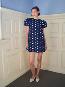 The Golden Hour Mini Dress in Navy Polka Dot
