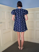 The Golden Hour Mini Dress in Navy Polka Dot