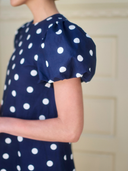 The Golden Hour Mini Dress in Navy Polka Dot