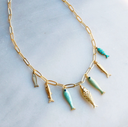 Desert Tide Necklace – Gold Chain with Playful Fish Charms